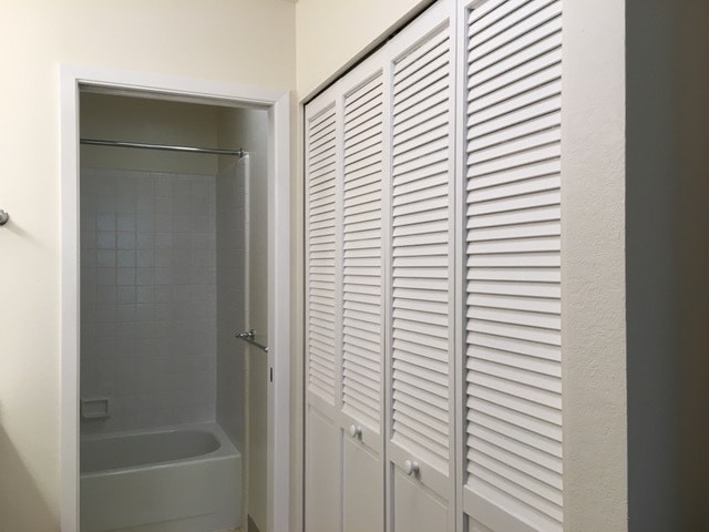 Hallway to the bathroom with refinished tub - 514 Seaver Dr