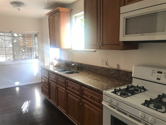 Kitchen with access door to the back yard. - 1448 Butler Ave