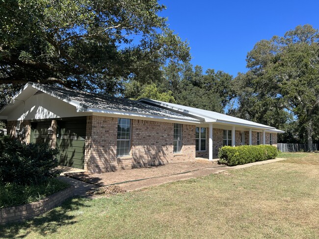 Side of house w/ double garage - 12821 County Road 9