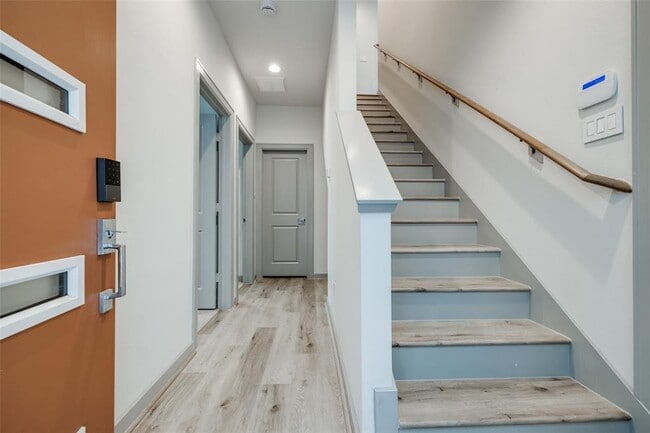 Front door view with stairs to second floor. 2 bedrooms down and 1 full bath. - 717 N Emile St