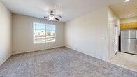 Located at 80175 Avenue 52 in La Quinta, California, this well-appointed one-bedroom, one-bathroom residence offers a thoughtfully designed single-level layout. The open-concept living and dining area is finished with plush carpeting and ceiling fans, creating a comfortable and airy atmosphere. Recessed lighting throughout adds a modern touch.

The kitchen is a functional centerpiece of the home, featuring warm wood cabinetry, granite-style countertops, a breakfast bar peninsula, and a full suite of stainless steel appliances including a gas range, over-the-range microwave, refrigerator, and dishwasher. Tile flooring in the kitchen provides a clean contrast to the carpeted living spaces. A pantry adds valuable storage.

The spacious bedroom is filled with natural light from dual windows and includes a ceiling fan. It connects to a generously sized walk-in closet with built-in shelving, along with additional closets for ample storage. The bathroom features wood-look flooring, a granite-topped vanity, a large mirror, and a tub-shower combination.

Additional highlights include a dedicated laundry area, a utility room, a balcony, and a hallway connecting the private spaces. This residence offers a practical and comfortable layout in the sunny Coachella Valley.
