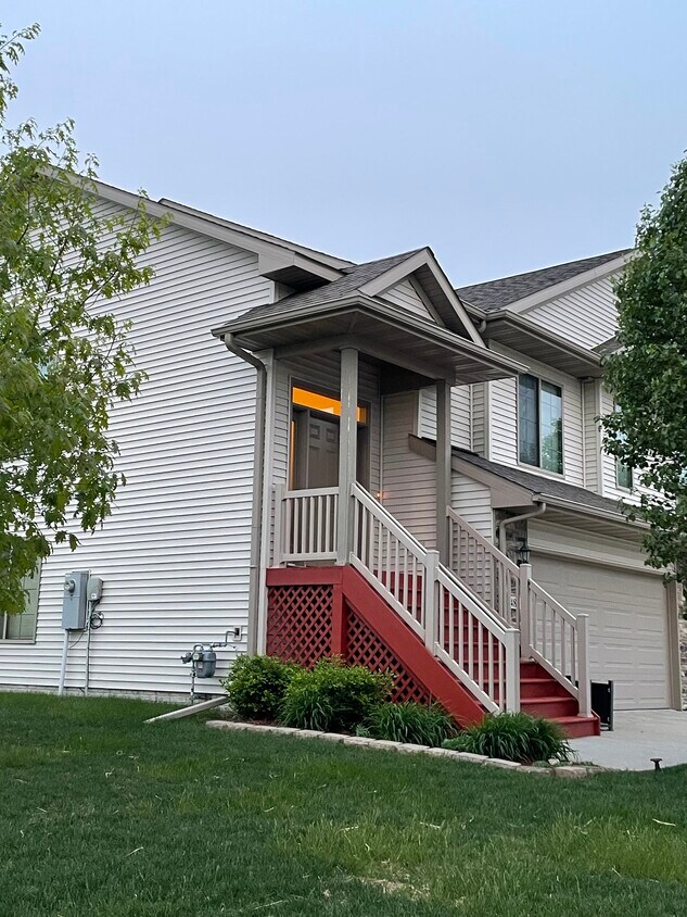 Newly stained front steps and small flower bed - 482 Watts Ct