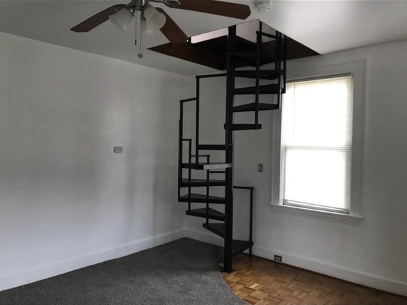 Spiral staircase in living room - 3124 Latonia Ave
