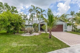 Building Photo - 9721 Carousel Cir N