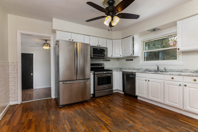 Kitchen leads into breezeway - 7923 S Rock Hill Rd