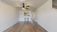 Located at 101 Tiffany Cir in Terrell, TX, this two-story home offers a practical and well-organized layout across two floors, with two bedrooms, three bathrooms, and dedicated spaces for everyday living. The main floor features an open-concept living and dining area with wood-look flooring, crisp white walls, and ceiling fans with light fixtures that keep the space bright and comfortable. A pass-through window connects the living area to the kitchen, which is equipped with warm honey-toned cabinetry, white appliances including a dishwasher, range, and refrigerator, and a built-in nook ideal for a small workspace. A convenient breakfast bar with seating provides a casual dining option. The main floor also includes a laundry area and access to the staircase leading to the upper level. Upstairs, two carpeted bedrooms offer a quiet retreat, each benefiting from natural light through sizable windows with views of the surrounding neighborhood. The spacious primary bedroom features dual windows and ample room for furnishings. Three full bathrooms — each with a tub-shower combination — are distributed across both floors for added convenience. Three closets throughout the home provide generous storage. The neutral color palette and clean finishes create a move-in-ready environment throughout.