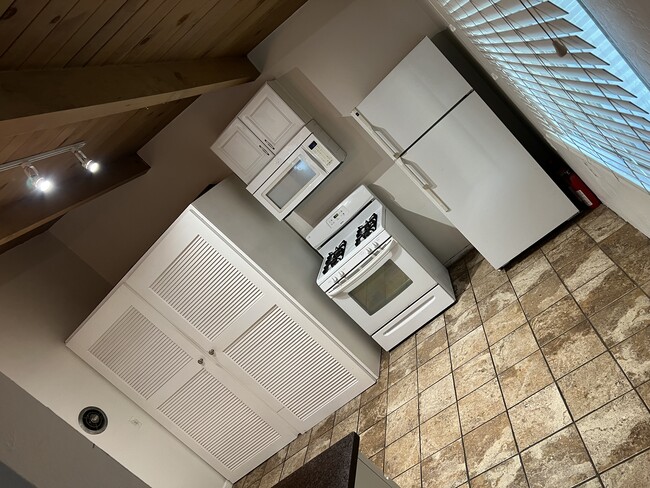 Kitchen laundry and appliances included with rental - 170 Casa St