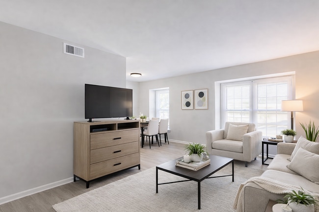 Modern open-concept living and dining space - Mountain Ridge Apartments