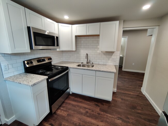 Kitchen with Stainless Steel Appliances and Garbage Disposal - 1814 26th St W