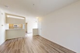 Located in Santa Rosa, CA, this well-appointed 2-bedroom, 2-bathroom single-floor residence offers a comfortable and functional layout. The open-concept living area features wood-style plank flooring and flows naturally into the combined dining and kitchen space. The kitchen is equipped with a peninsula countertop in light stone, warm wood cabinetry, a stainless steel refrigerator, a gas range, and a built-in microwave — providing ample workspace and storage. A ceiling fan anchors the dining area, enhancing comfort throughout.

Sliding glass doors in the living room lead to a private balcony with outdoor views, filling the space with natural light. The two bedrooms feature plush carpeting and large windows with vertical blinds, each offering generous closet space. The primary bedroom includes hardwood-style flooring and a ceiling fan. Both bathrooms are clean and functional, with one featuring a full soaking tub with tiled surround.

A dedicated in-unit laundry room accommodates a full-size side-by-side washer and dryer. Two hallways connect the rooms efficiently throughout the layout. Three closets provide additional storage across the residence, rounding out this practical and inviting home in Santa Rosa.