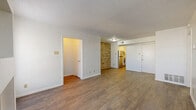 Located at 3253 Hillcrest Drive in San Antonio, TX, this single-story 2-bedroom, 2-bathroom home offers a practical and comfortable layout across a well-utilized floor plan. The living room serves as a central gathering space, featuring rich wood-look flooring, a classic fireplace flanked by windows that bring in natural light, and a textured ceiling. An accent brick wall adds character as you move toward the dining area and kitchen, which is equipped with stainless steel appliances. The open flow between the living, dining, and kitchen areas creates a connected and functional common space. Both bedrooms are carpeted for comfort and include ceiling fans, generous closet space, and windows with blinds. The spacious primary bedroom features a walk-in closet, providing ample storage. Each of the two bathrooms is finished in a clean, all-white palette with a tub-shower combo, vanity, and wood-look flooring. Additional highlights include a utility room, a hallway connecting the private areas, and multiple closets throughout. The covered patio with a slatted wood privacy fence offers an outdoor retreat. The home is completed by a dedicated entrance and a well-organized, single-level layout ideal for everyday living.