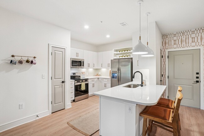Kitchen with Quartz Countertop and Stainless Steel Appliances. - Solay Cape Coral