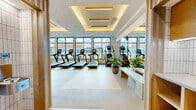 Imagine starting each day in your own private health retreat, where every detail is designed to inspire and motivate. This extraordinary 3,020 square foot space redefines the concept of home fitness, offering a sanctuary where you can sculpt your best self.

Step into a world of soaring ceilings adorned with sleek, modern lighting that creates an ambiance of energy and focus. Floor-to-ceiling windows flood the space with natural light, providing breathtaking views of Nashville's vibrant cityscape as you push your limits.

The main workout area is a fitness enthusiast's dream, boasting a comprehensive array of top-of-the-line cardio equipment. Multiple treadmills, ellipticals, and stationary bikes stand ready to elevate your heart rate and stamina. For those seeking to build strength, a fully-equipped weight training section features the latest in resistance machines and free weights.

A dedicated studio space, complete with wooden flooring and mirrored walls, offers the perfect setting for yoga, dance, or high-intensity interval training. This versatile area adapts to your changing fitness needs and goals.

The thoughtful design extends to every corner, with ample space for stretching and cool-down routines. High-tech touches, including built-in speakers and smart TV systems, allow you to personalize your workout experience.

Located at 901 Third Ave N, this fitness haven places you at the epicenter of Nashville's vibrant culture. After your workout, step out to enjoy the city's renowned music scene, eclectic dining, and bustling nightlife.

Transform your life and achieve your fitness aspirations in this unparalleled space. It's not just a gym; it's a commitment to your health, a statement of your success, and a gateway to the best version of yourself. Welcome to your new lifestyle – where luxury meets wellness, and every day is an opportunity to thrive.