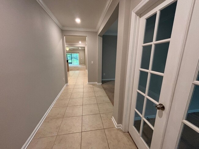 Building Photo - Modern 4 Bed 2 Bath Home. Double Garage. Screened in Lanai. Bonus Room. Minutes from World Golf V...