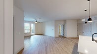 Located at 212 Durham Ave in Metuchen, NJ, this well-appointed 2-bedroom, 2-bathroom residence offers a thoughtfully designed single-floor layout with modern finishes throughout. Light hardwood flooring flows seamlessly across the entire space, complementing the clean, neutral color palette.

The open-concept kitchen and living area serves as the heart of the home. The kitchen features white upper cabinetry, stainless steel appliances including a refrigerator, microwave, and range, and a large center island with a white quartz countertop, undermount sink, and stylish pendant lighting — ideal for both cooking and casual dining.

The spacious primary bedroom includes a ceiling fan, large windows that invite natural light, and access to an outdoor balcony. The second bedroom is equally well-lit, also featuring a ceiling fan and windows with outdoor views. Both bedrooms are supported by dedicated closets outfitted with wire shelving systems for organized storage.

The two bathrooms are finished with gray vanity cabinetry, white quartz countertops, and matte black hardware accents. One bathroom includes a walk-in glass shower, while the other offers a tub-shower combination — both with light hardwood-style flooring.

A dedicated in-unit laundry room houses a full-sized GE front-loading washer and dryer, adding everyday convenience to this modern Metuchen residence.