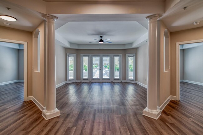 Unique living room layout with large windows that offer an abundance of light - Windsor at Midtown