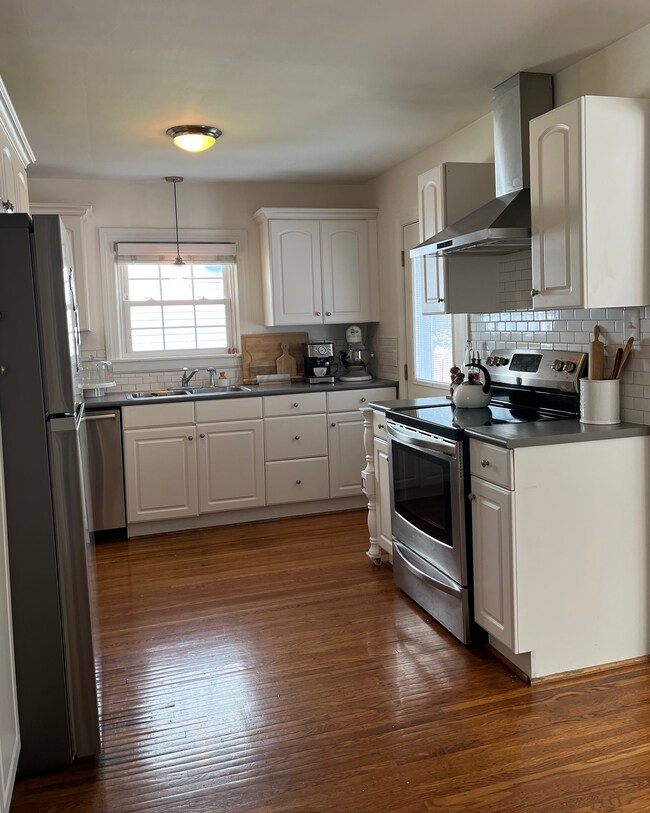 Updated kitchen with stainless steel appliances. Entire house has hardwood floors. - 4012 Winchester Rd