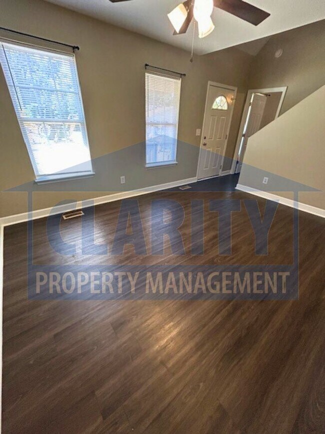 Building Photo - Charming three-bedroom home with carport!