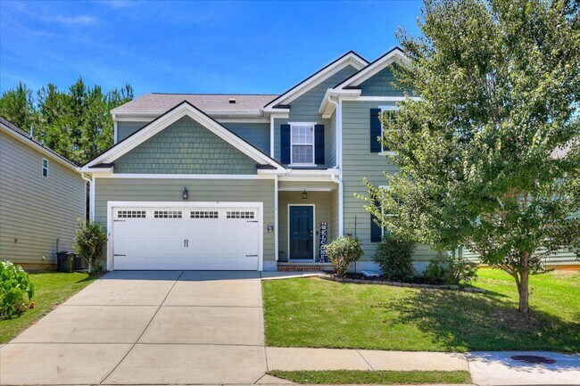 Building Photo - 4 bed/2.5 bath home with fenced yard and g...