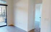 This contemporary 1-bedroom apartment in Upper Kirby offers 610 square feet of efficiently designed living space. The unit features two full bathrooms, providing convenience and flexibility for residents and guests. The primary bedroom is generously sized at 170 square feet, offering ample space for relaxation and storage.

The kitchen is a standout feature, showcasing modern white cabinetry, stainless steel appliances, and a stylish blue subway tile backsplash. A large refrigerator and built-in microwave enhance functionality, while the kitchen island with a deep sink adds extra prep space and potential for casual dining.

Throughout the apartment, light wooden flooring creates a warm and inviting atmosphere. Large windows in the bedroom and living areas flood the space with natural light, while also offering views of the surrounding area. The living room is spacious enough to accommodate comfortable seating and entertainment options.

Both bathrooms are well-appointed, with one featuring elegant marble-look tiling and a bathtub-shower combination. Modern fixtures and clean lines contribute to the overall contemporary aesthetic.

The apartment's layout is thoughtfully designed to maximize space efficiency, with a dedicated closet area and a compact in-unit laundry space. The overall design aesthetic is clean and minimalist, with a predominantly white color scheme that creates a sense of openness and brightness throughout the space.