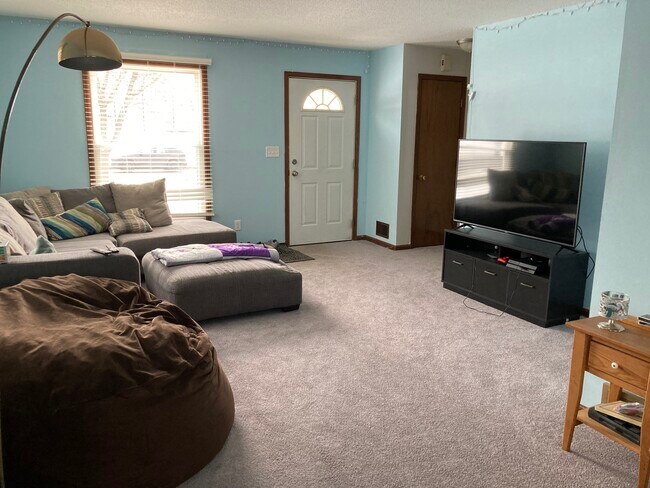 Living room and front entry - 107 Cretin Ave N