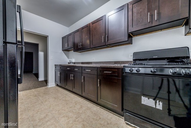 Foto del edificio - 4 br, 2 bath Apartment - 5046 S Champlain Ave