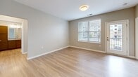 Located on Old Hickory Blvd in Nashville, TN, this single-story, 3-bedroom, 3-bathroom home offers a well-designed layout with a consistent, modern aesthetic throughout. The kitchen is appointed with rich, warm-toned cabinetry, granite countertops, light wood-style flooring, and stainless steel appliances including a full-size refrigerator, making it both functional and stylish. The living and common areas continue the light wood-style flooring, lending a clean, cohesive feel to the space. Each of the three bedrooms is carpeted for comfort, with neutral warm-gray walls and windows fitted with blinds that allow for natural light and outdoor views of the surrounding neighborhood. The spacious primary bedroom includes a walk-in closet with built-in shelving for ample storage. All three bathrooms are finished with the same granite-topped vanities and warm wood cabinetry as seen in the kitchen, maintaining a unified design language. The bathrooms feature light wood-style tile flooring and tub-shower combinations. A hallway connects the rooms, and an additional closet provides extra storage. The overall ambiance is clean, neutral, and move-in ready.