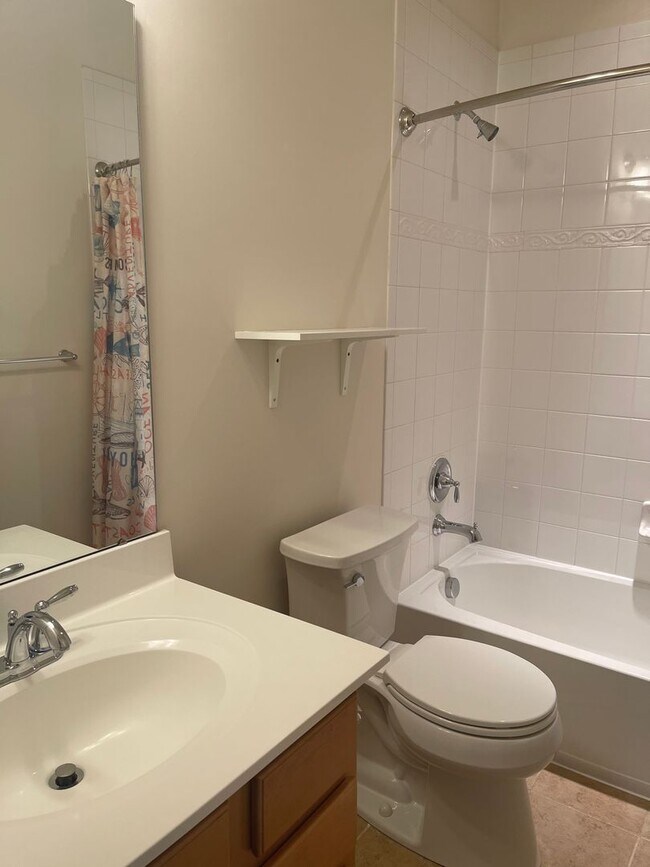 Building Photo - END UNIT TOWNHOUSE WITH 2 CAR GARAGE, WOOD...