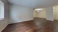 This 870 square foot apartment in Pittsburgh offers a thoughtful layout and modern amenities. The single-floor living space comprises a bedroom, kitchen, living room, and two closets. The primary bedroom, measuring 210 square feet, provides ample space and features carpeting and a large window for natural light. The kitchen is a highlight, boasting wooden cabinetry, black appliances, and granite countertops. It opens to the living area, creating an open-concept feel. The living room is spacious with hardwood flooring that extends throughout most of the apartment, adding warmth and elegance. The apartment's design incorporates textured ceilings and neutral-toned walls, creating a bright and airy atmosphere. Windows in each room offer natural light and views. Storage is plentiful with two closets, including one with built-in shelving. The overall ambiance is modern and inviting, perfect for comfortable urban living in Pittsburgh's vibrant Centre Avenue area.