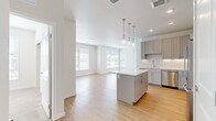 Located on E 11th Ave in Aurora, CO, this single-floor residence offers three bedrooms and three bathrooms within a thoughtfully designed, modern layout. The open-concept kitchen and living area serves as the heart of the home, featuring light wood-look flooring, crisp white walls, and abundant natural light from multiple windows. The kitchen is well-appointed with gray shaker-style cabinetry, white quartz countertops, stainless steel appliances, a subway tile backsplash, and a central island illuminated by stylish glass pendant lights — ideal for both cooking and casual dining.

The living area flows seamlessly from the kitchen, creating an airy, connected space bathed in natural light. The bedrooms feature neutral carpeting, ceiling fans, and generous closet space, including a walk-in closet in the primary bedroom. The bathrooms maintain the home's clean aesthetic with white subway tile surrounds, wood-look flooring, and white vanities with modern fixtures. Additional secondary bedrooms include light wood flooring and bright windows. Throughout, the design emphasizes a consistent, contemporary palette of whites and neutrals, contributing to a clean and welcoming overall ambiance.