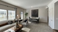This single-floor residence in Oklahoma City, Oklahoma offers a thoughtfully designed layout that balances comfort and style. The open-concept living and dining area is filled with natural light streaming through large windows dressed with blinds and curtains, creating a bright and welcoming atmosphere. Soft carpeting runs throughout the main living spaces, complementing the neutral color palette on the walls and ceilings. The living area provides generous room for seating and entertaining, flowing naturally into the dining space, which features direct access to the outdoors via a side door.

The multiple bedrooms are well-proportioned and share a consistent design language, each equipped with ceiling fans with light fixtures, carpeted floors, and windows that invite natural light. The primary bedroom offers ample space and a calm, restful ambiance, while the additional bedrooms are equally comfortable and versatile.

The bathroom is a standout feature, showcasing patterned tile flooring, a marble-look countertop with an undermount sink, dark wood cabinetry, and a full tub-shower combination. A large mirror and overhead lighting complete the functional yet stylish space.

Throughout the residence, the design maintains a cohesive, modern aesthetic with warm, neutral tones that create an inviting and livable environment.