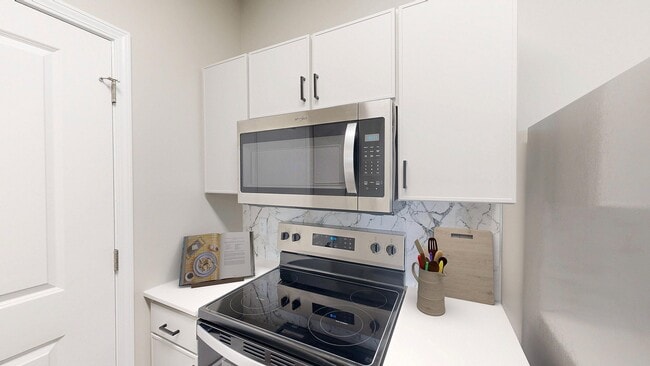 Newly Renovated Kitchen with Quartz Countertops - Double Creek Flats Apartments
