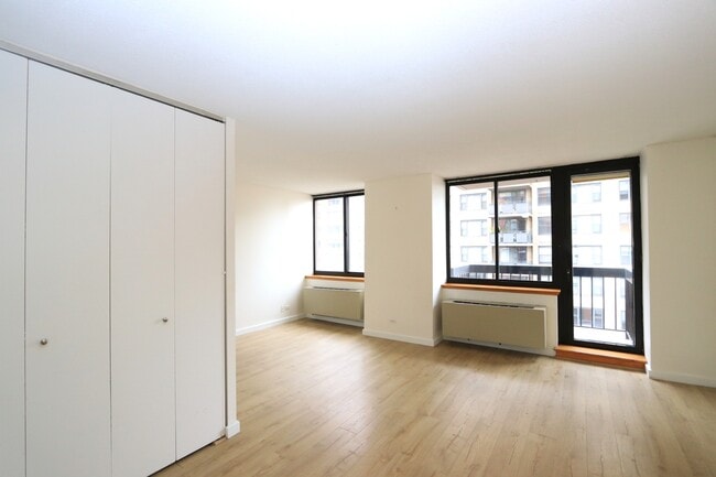 Living Rm with Balcony Door & AlcoveDoor, - 250 E 40th St Apartment