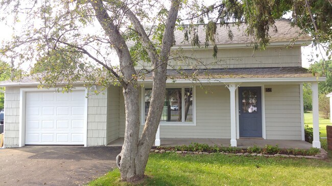 Newly paved double wide driveway. Large single car garage. - 181 W Seneca St