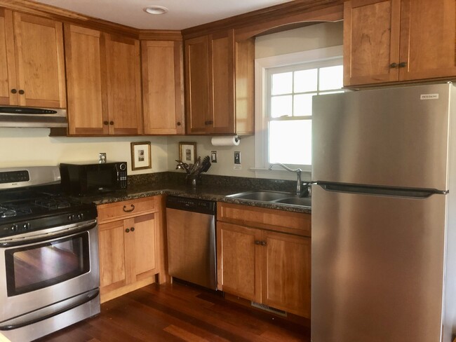 Kitchen includes stove, dishwasher, refrigerator, and microwave - 4661 Kimages Wharf Rd