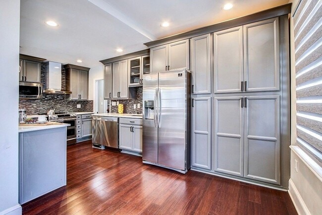 Photo - Gorgeous 5 BED + 3.5 Ba in Main House, 1 + 1 in BSMT, 1 + 1 above garage  in the Heart of Downtow...