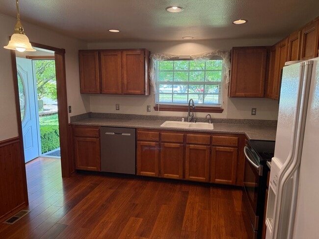 Building Photo - Beautiful 3 Bedroom Ranch Style House with 2 Car Garage, Fences Yard, Fireplace, Shed, Workshop &...