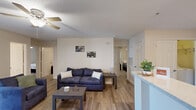 Located at 2813 Spring Garden St in Greensboro, NC, this single-floor, 3-bedroom, 2-bathroom home offers a well-designed layout with functional living spaces throughout. The open-concept living room features wood-style flooring, a ceiling fan, textured ceilings, and French doors that invite natural light and provide outdoor access. The kitchen is efficiently equipped with light wood cabinetry, white appliances including a refrigerator, range, and built-in microwave, along with a light stone countertop and a peninsula that opens to the living area. A convenient in-unit laundry area is accessible directly from the kitchen. The three bedrooms are carpeted for comfort, each featuring ceiling fans and window blinds that allow for natural light control. The primary bedroom offers a generous footprint with ample room for a full furniture arrangement. Both bathrooms are finished with light wood vanity cabinetry, stone-style countertops, hardwood-style flooring, and tub-shower combinations. Two closets provide additional storage throughout the home. The overall aesthetic is clean, neutral, and practical, making this a well-rounded residential space suited for a variety of occupants.