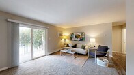 Located at 200 W 75th Pl in Merrillville, Indiana, this single-floor residence offers a thoughtfully designed layout encompassing generous living space across a well-organized floor plan. The unit includes two distinct living areas, providing flexible options for lounging and entertaining. The primary living room features plush carpeting, warm neutral tones, and a sliding glass door that opens to a private balcony overlooking a tree-lined exterior — an inviting spot for outdoor relaxation. The dining room is a defined, intimate space finished with wood-look flooring, a ceiling fan, and a decorative round mirror that adds depth to the room. The galley-style kitchen is well-appointed with gray shaker cabinetry, granite-look countertops, stainless steel appliances including a refrigerator, electric range, and dishwasher, and durable hardwood-style flooring throughout. The bedroom offers comfortable carpeting, a natural window with greenery views, a built-in closet, and baseboard heating. The full bathroom includes a tub/shower combination with updated brushed nickel fixtures and wood-look tile flooring. A dedicated closet provides additional storage, completing this functional and comfortable Merrillville residence.