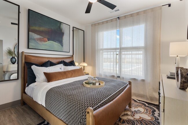 Model apartment bedroom with modern finishes at Montage West Lafayette. - Montage West Lafayette