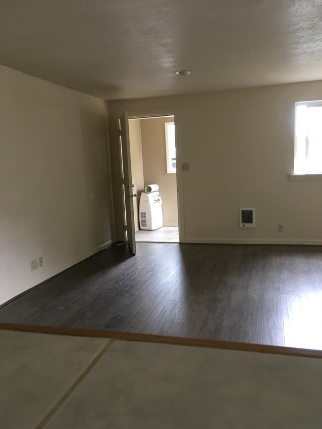 All photos were taken before furnishing.Living Room has couch, piano, 2 person table - 1521 Carr Blvd