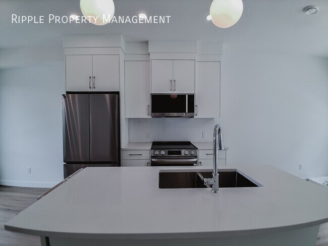 Photo du bâtiment - BRAND NEW 3-BEDROOM UPPER UNIT | BRIGHT CORNER LOT & DEDICATED GARAGE