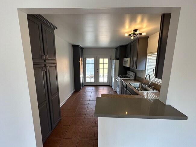 kitchen view from living room - 6173 Ruby Pl