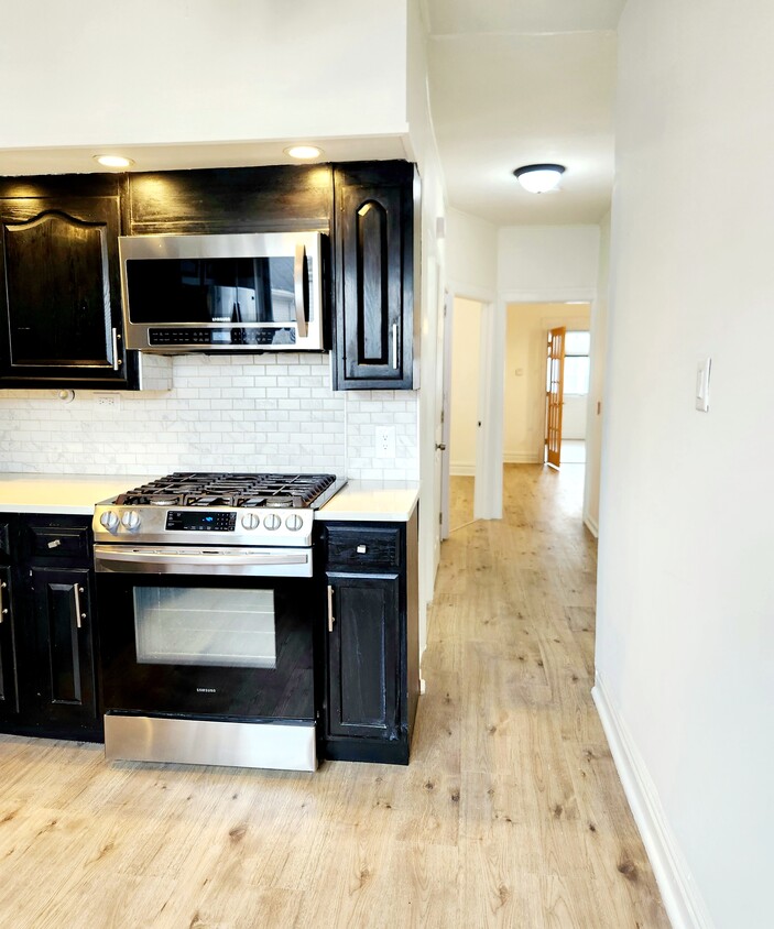 kitchen through living room - 27 Newark Bay Ct