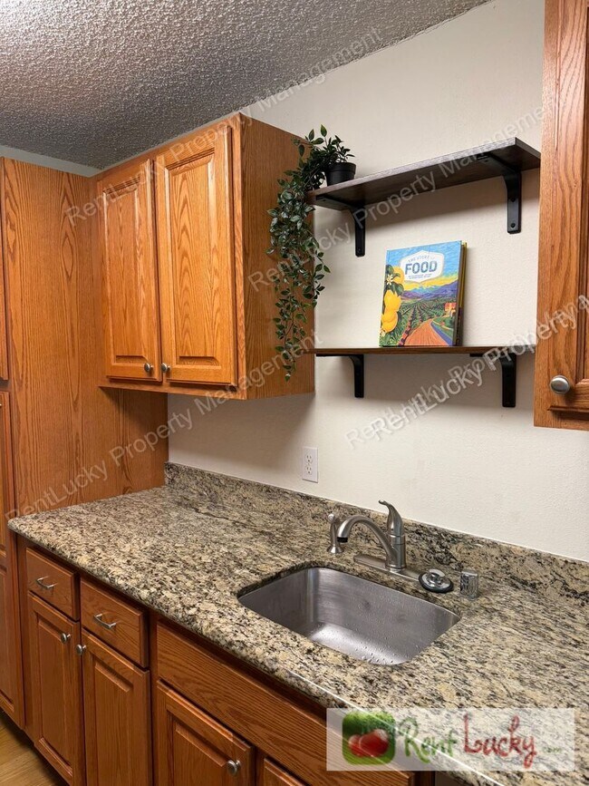 Building Photo - Kirkland Gem! Ground-Floor 1-Bedroom Condo w/2 Parking Spots & Beautiful Fireplace!