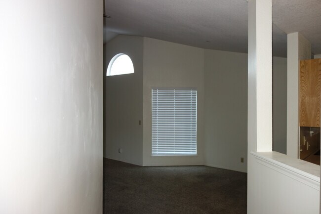 View as you open the door. Kitchen and dining to the right and large vaulted living room to the left - 6650 S Victor Ave