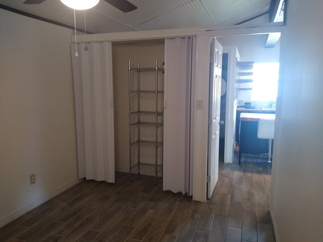 Bedroom closet. - 9328 N Ashley St