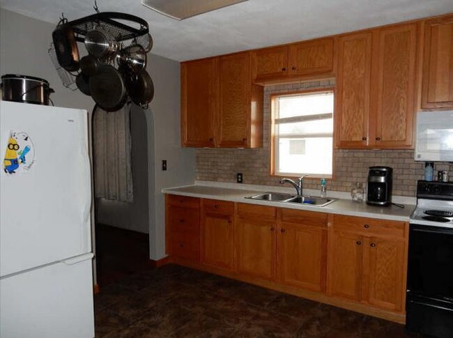 Updated kitchen with refrigerator, range, microwave. - 622 Markley Avenue South