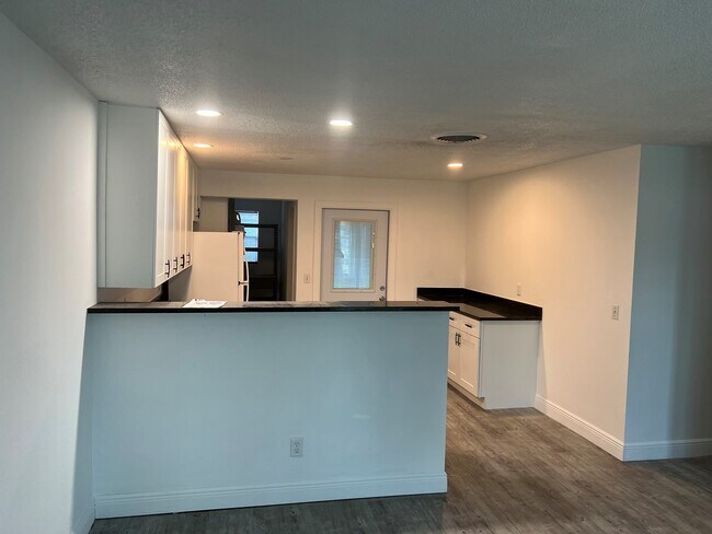 Kitchen from Living Room - 2405 NE Rustic Plz