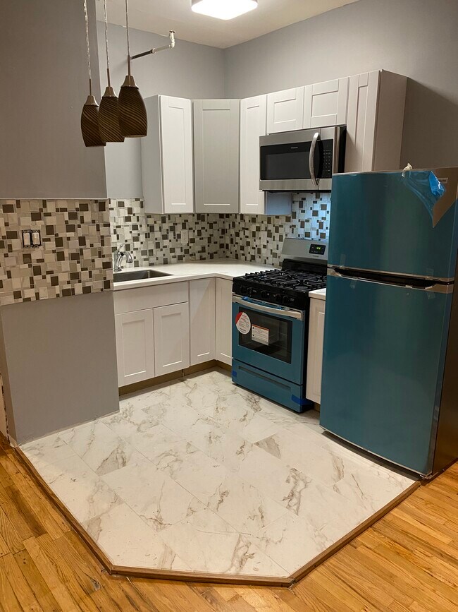 Open renovated kitchen, all new appliances and quartz countertop - 295 Stuyvesant Ave